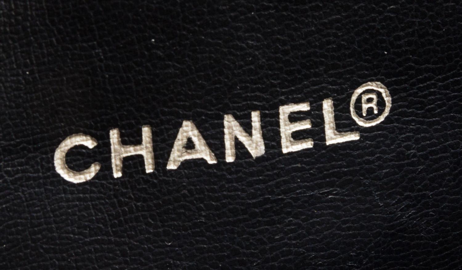 A Chanel Navy Quilted Leather Flap Handbag, 11" x 10" x 3".