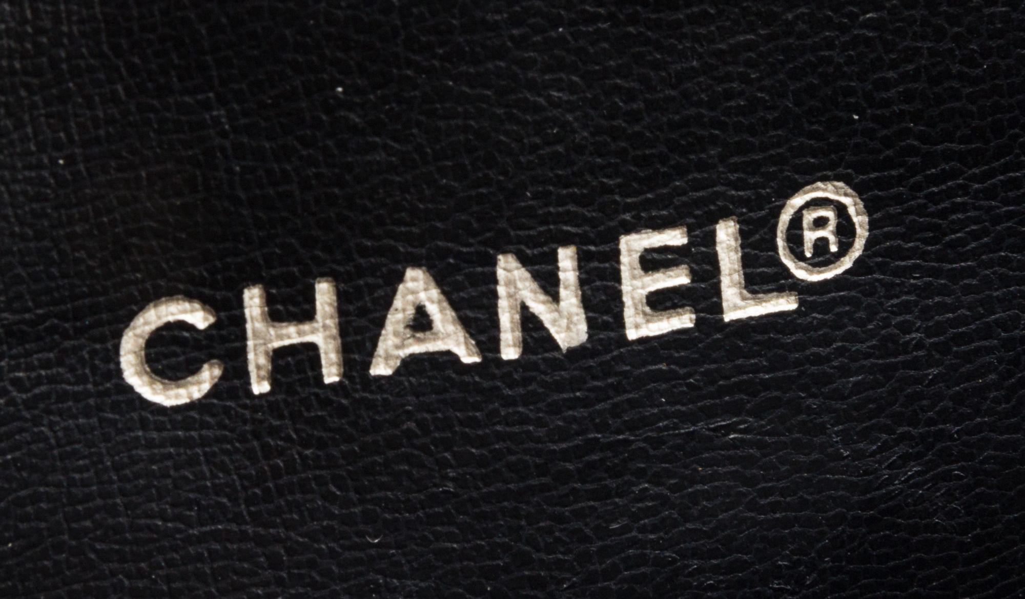 A Chanel Navy Quilted Leather Flap Handbag, 11" x 10" x 3".