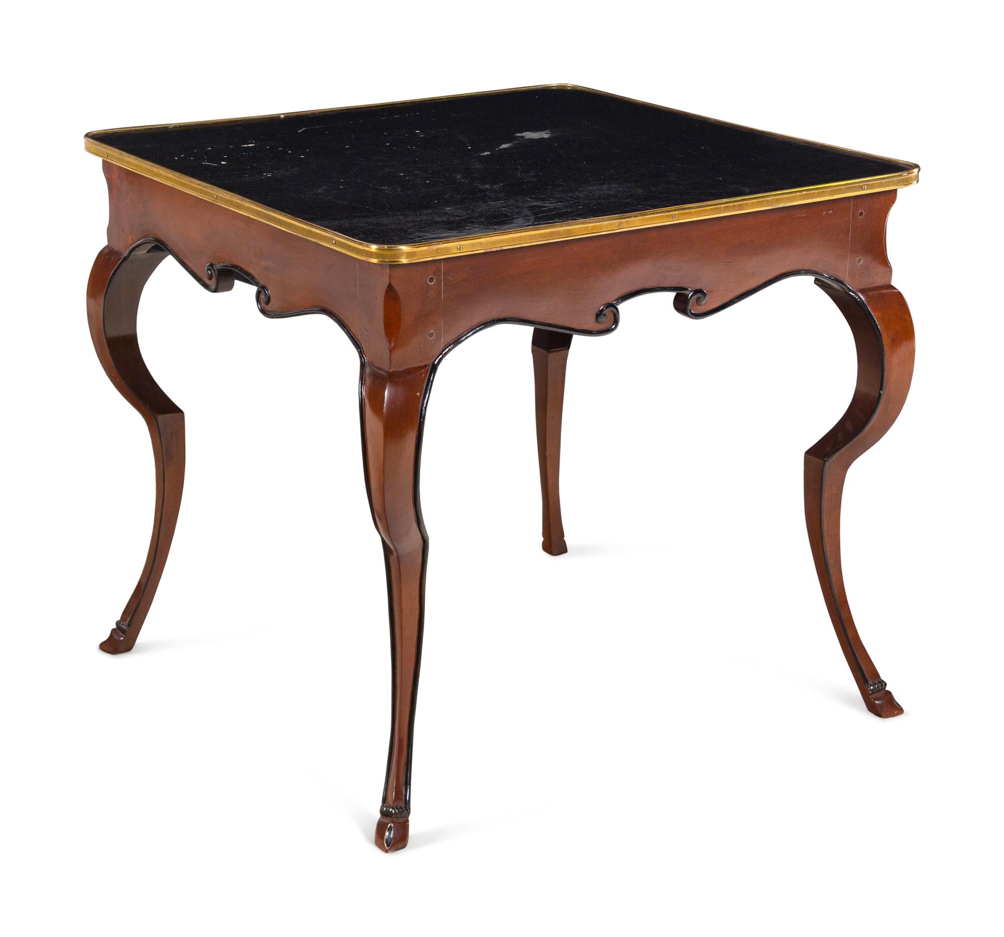 A French Gilt Metal Mounted Parcel Ebonized Mahogany Game Table