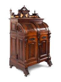 A Victorian Walnut and Bird’s Eye Maple Wooten Patent Desk