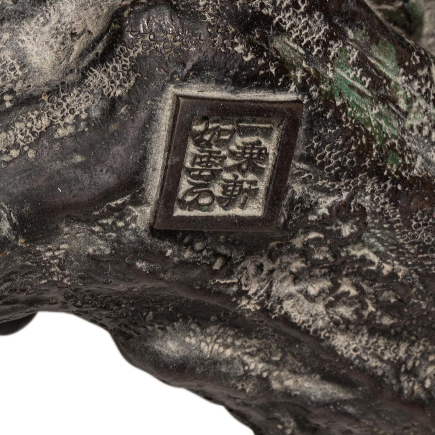A Japanese Bronze Figural Group of a Hawk Hunting Monkeys