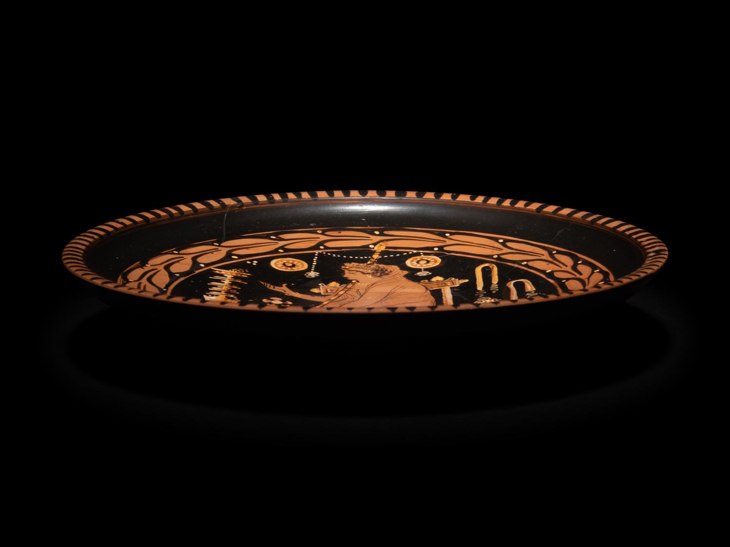An Apulian Red-Figured Plate with a Seated Goddess or Priestess