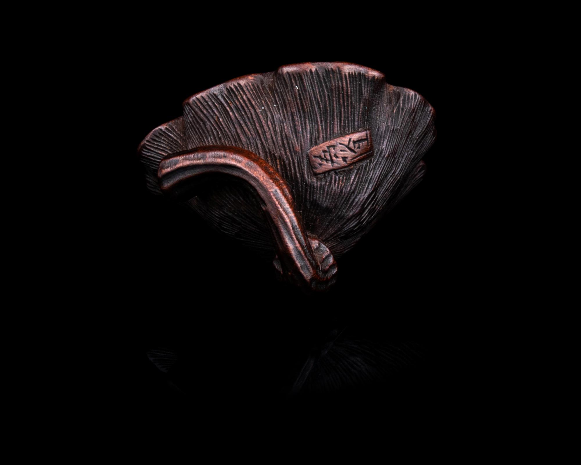 A Japanese Wood Netsuke of Lotus Pod
