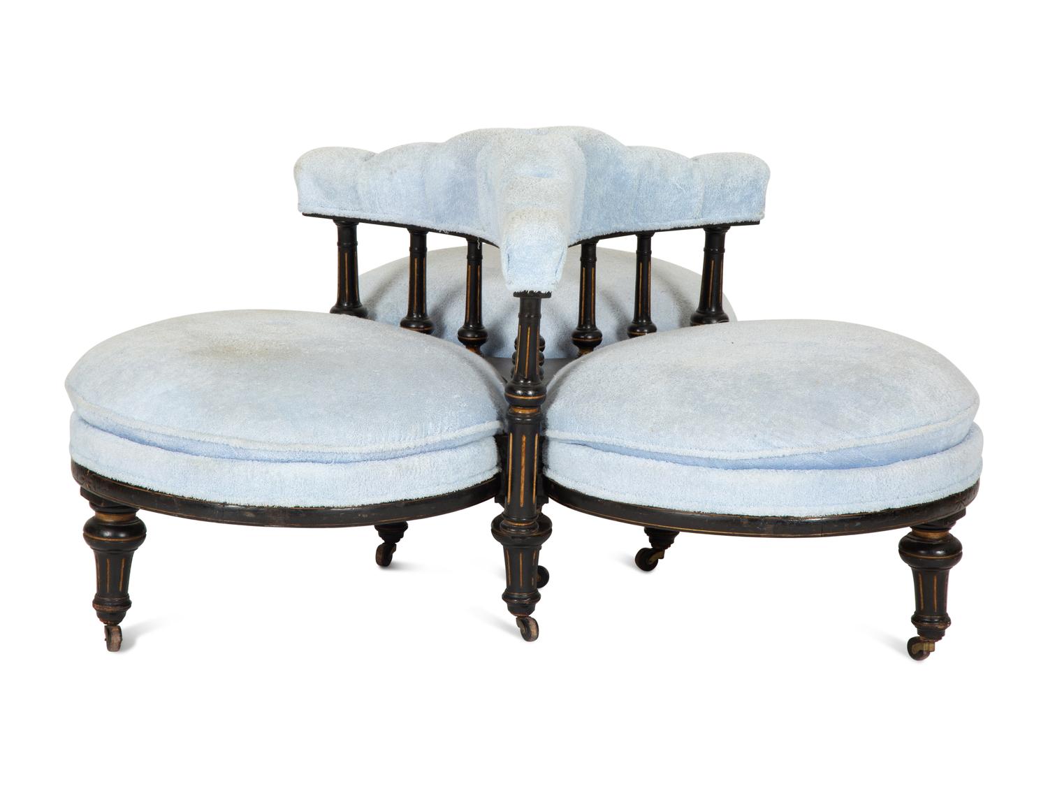 A Victorian Ebonized and Gilt Decorated Tête-à-Tête