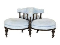 A Victorian Ebonized and Gilt Decorated Tête-à-Tête