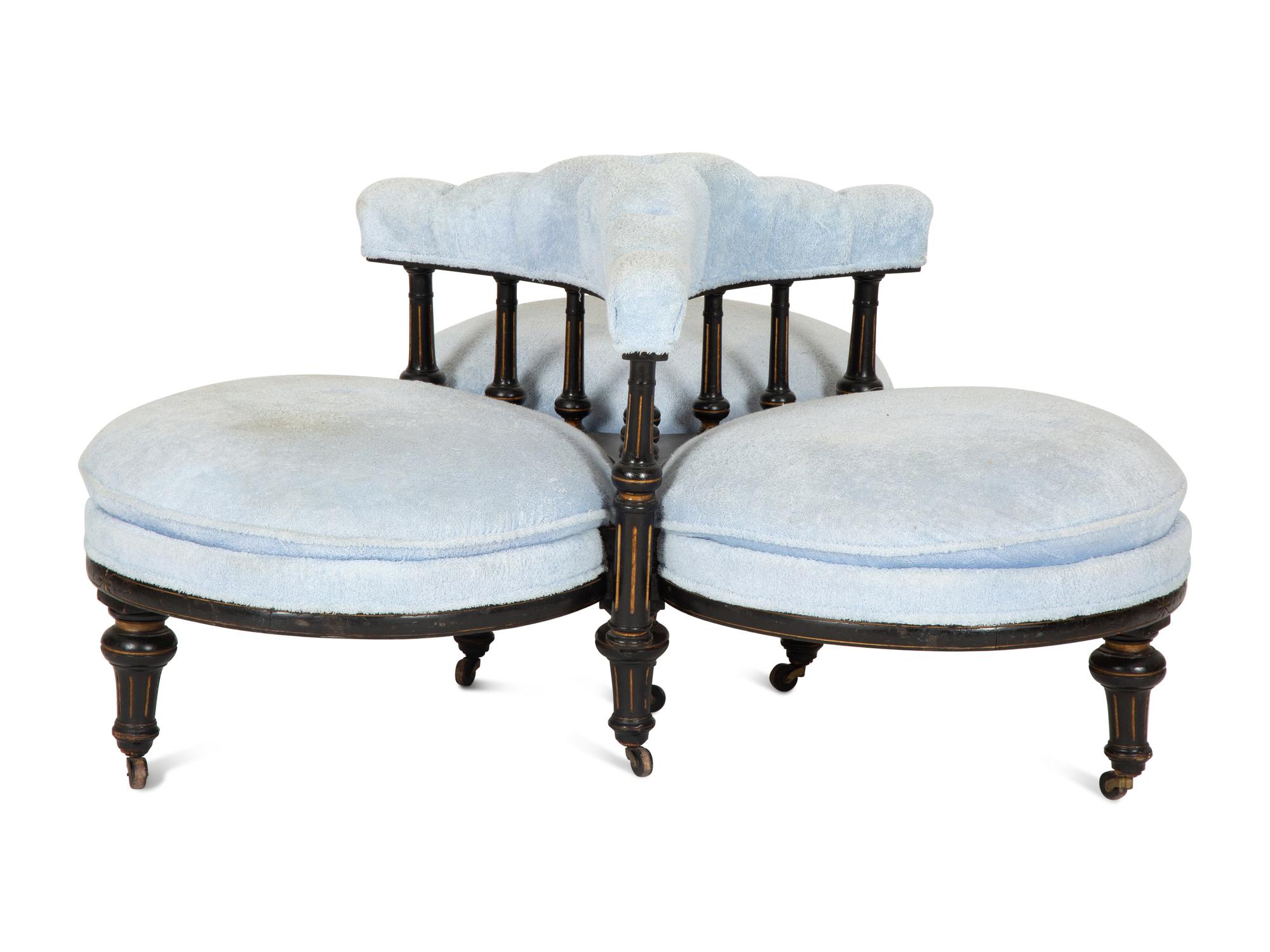 A Victorian Ebonized and Gilt Decorated Tête-à-Tête