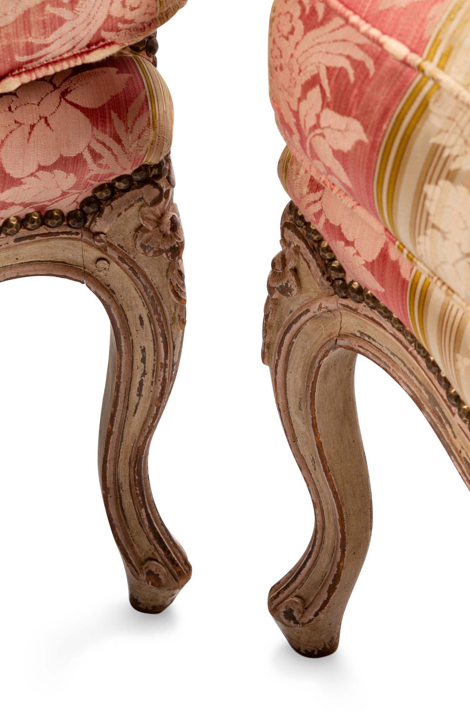 A Pair of Louis XV Silk-Upholstered and Painted Bergeres