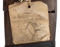 [SCIENCE & TECHNOLOGY]. James A. Rigby patent model for a "Combined Trunk, Desk, Table &c." with original tags, 1882.