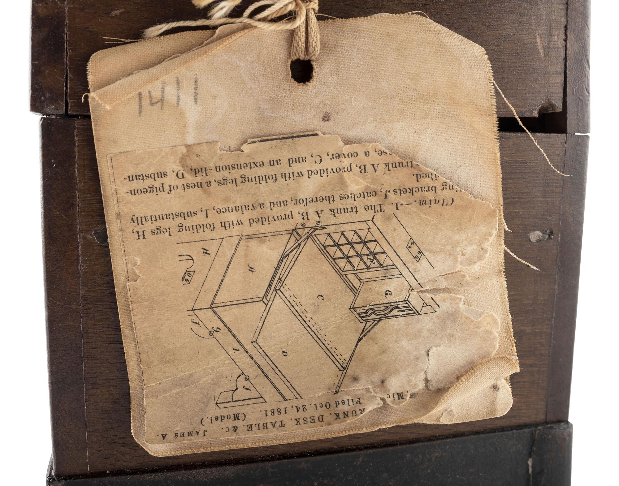 [SCIENCE & TECHNOLOGY]. James A. Rigby patent model for a "Combined Trunk, Desk, Table &c." with original tags, 1882.