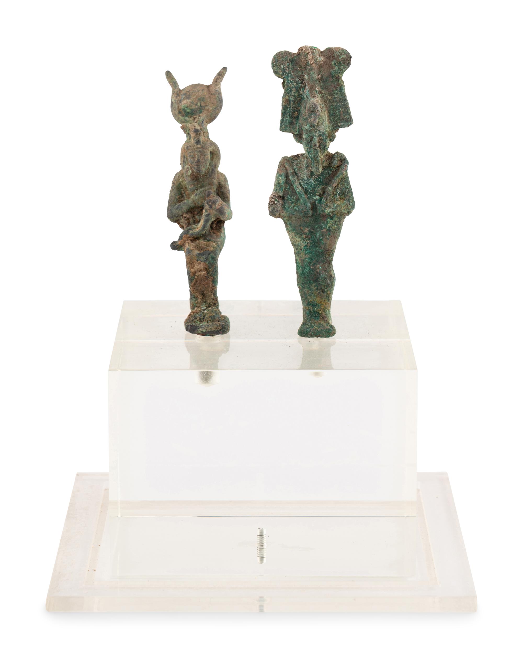 An Egyptian Bronze Osiris and Isis nursing Harpocrates