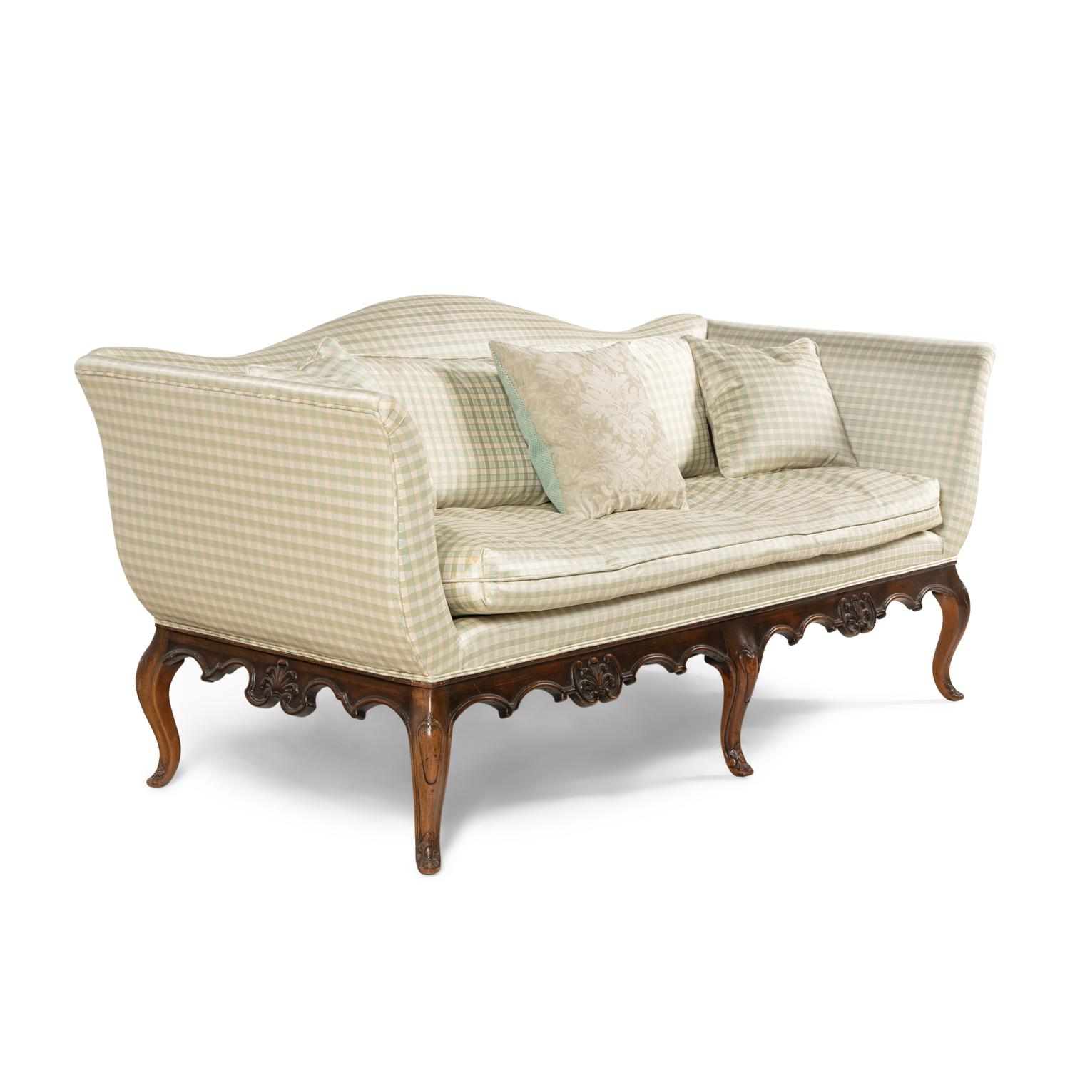 A Venetian Style Walnut Camelback Sofa