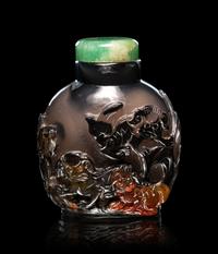 Two Carved Agate 'Fu Lion' Snuff Bottles