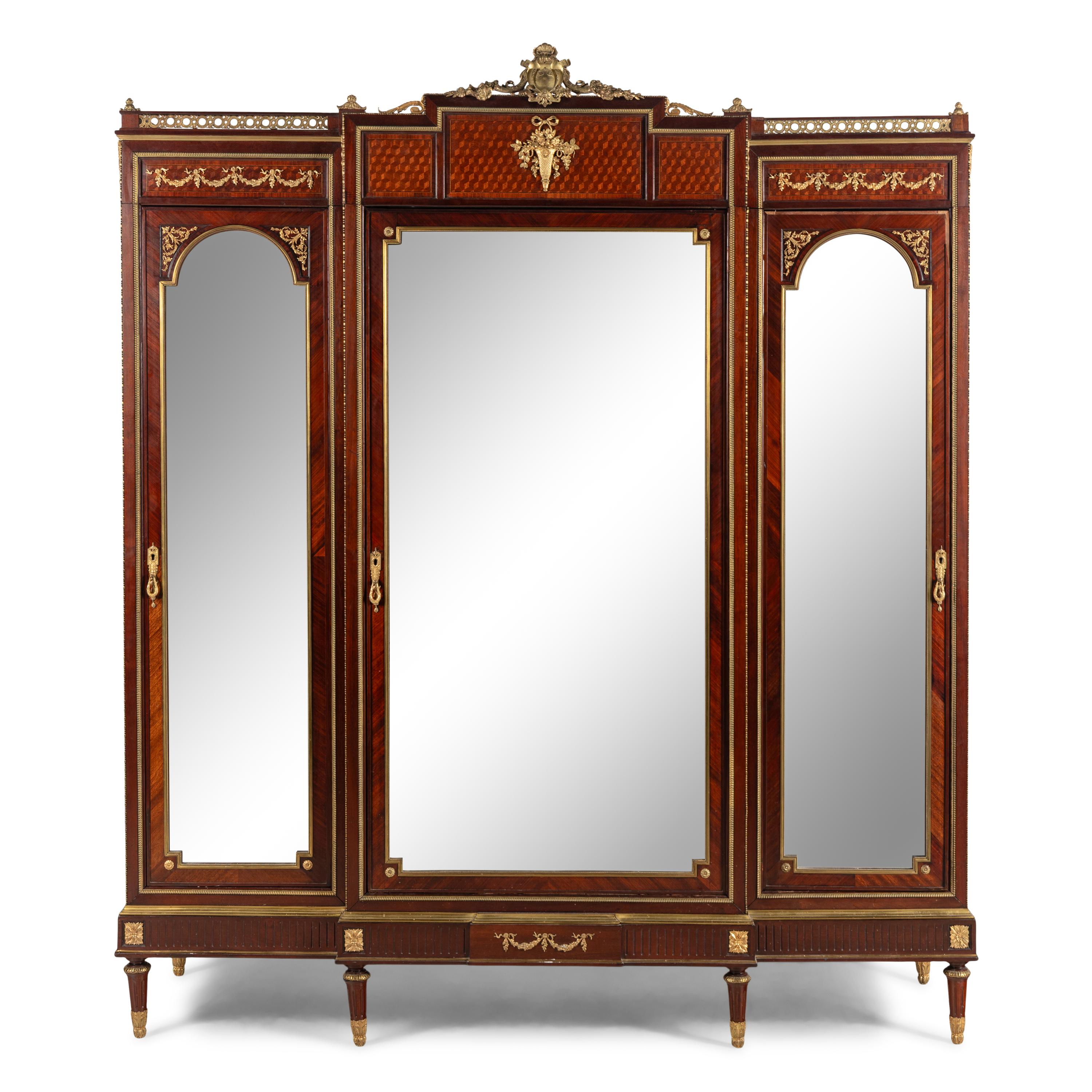 A Louis XVI Style Mahogany, Parquetry and Gilt Bronze Mounted Dressing Cabinet