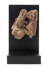 An Indian Red Sandstone Fragment of Shiva and Parvati Height 9 1/2 inches. — 11TH CENTURY