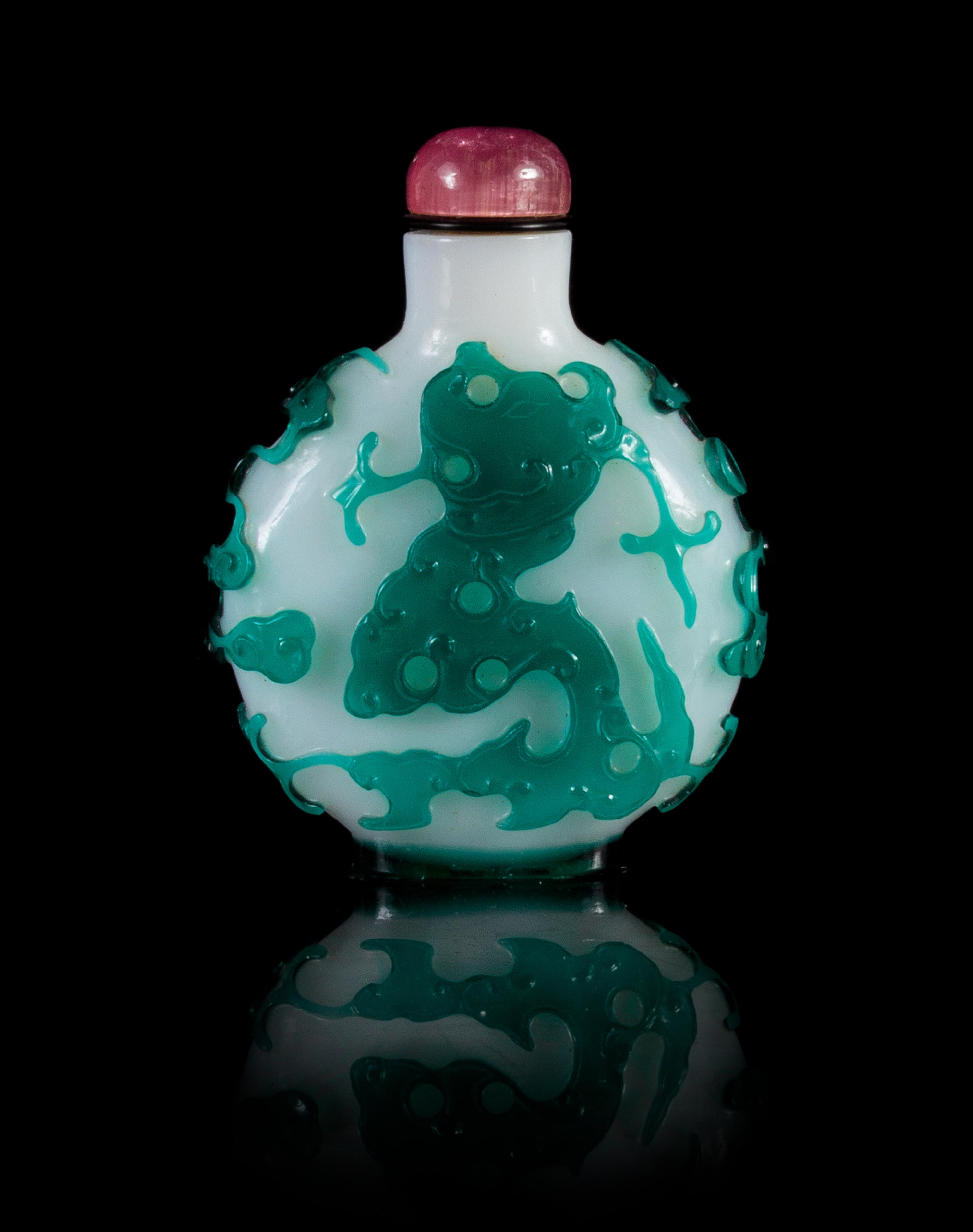 A Green Overlay Peking Glass Snuff Bottle Height 2 3/4 inches.