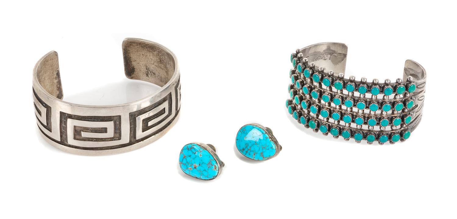 Two Southwestern Cuff Bracelets Length of largest 5 1/8 x opening 1 1/8 x width 1 1/4 inches