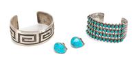 Two Southwestern Cuff Bracelets Length of largest 5 1/8 x opening 1 1/8 x width 1 1/4 inches