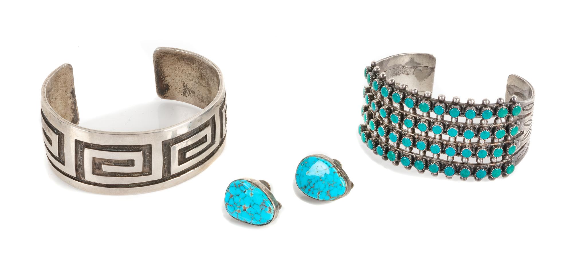 Two Southwestern Cuff Bracelets Length of largest 5 1/8 x opening 1 1/8 x width 1 1/4 inches