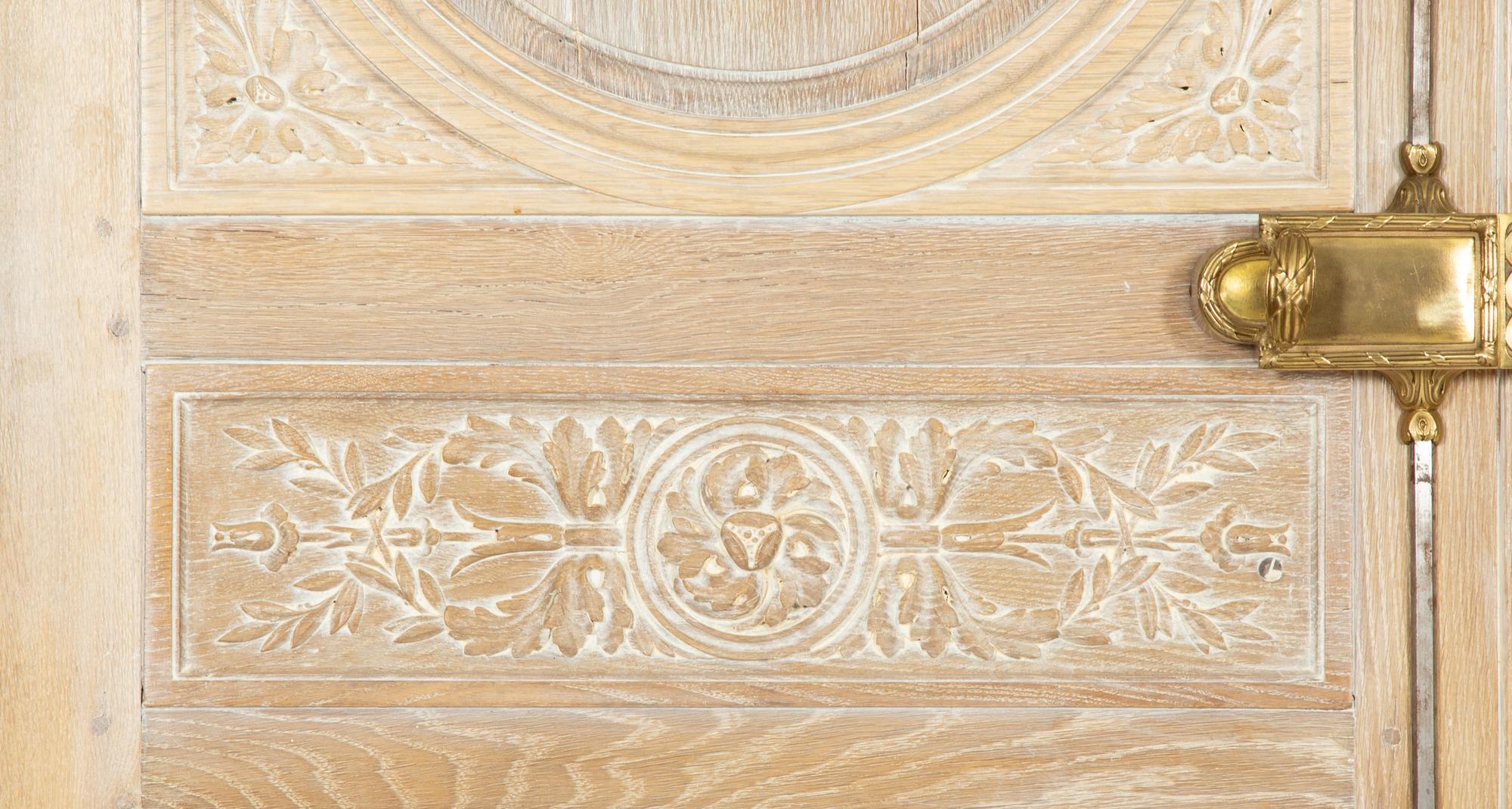 A Pair of French Cerused Oak Doors with Gilt Bronze Fixtures