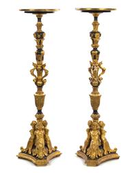 A Pair of Italian Ebonized and Giltwood Columns, Height 58 1/2 inches.