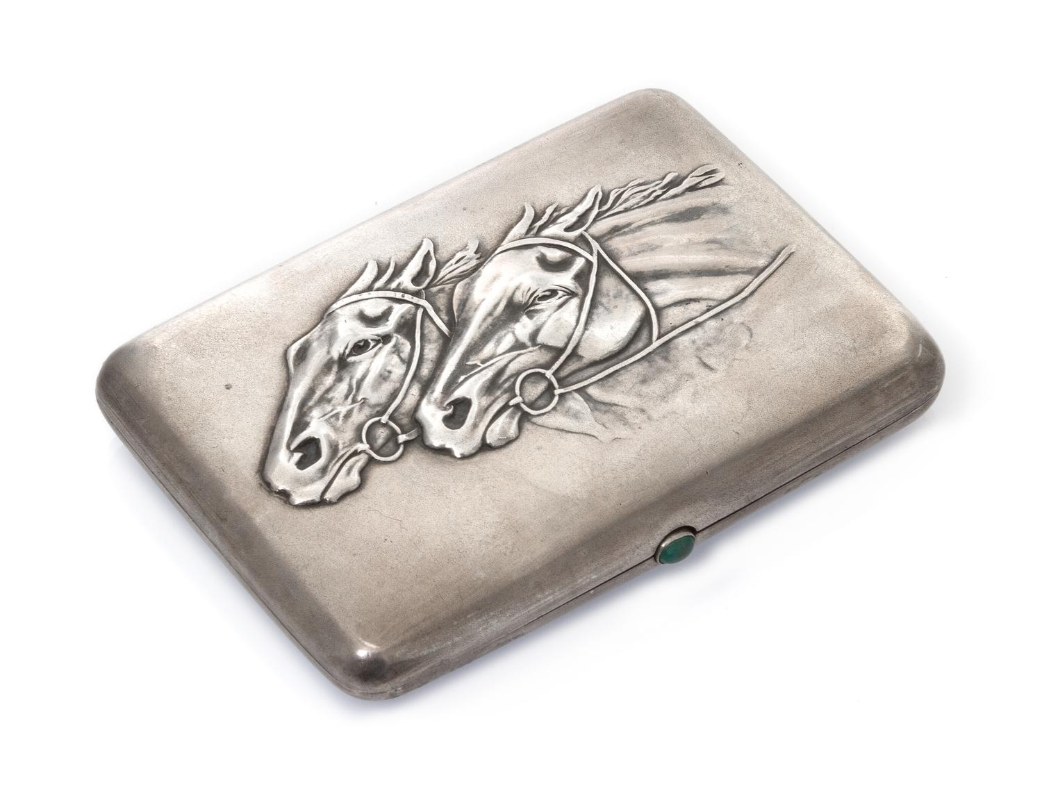 A Russian Silver Cigarette Case, Mark of Second Artel, Moscow, early 20th century, the lid worked to show two horses racing and having