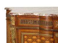 A Louis XVI Style Gilt Bronze Mounted Kingwood and Marquetry Marble-Top Commode