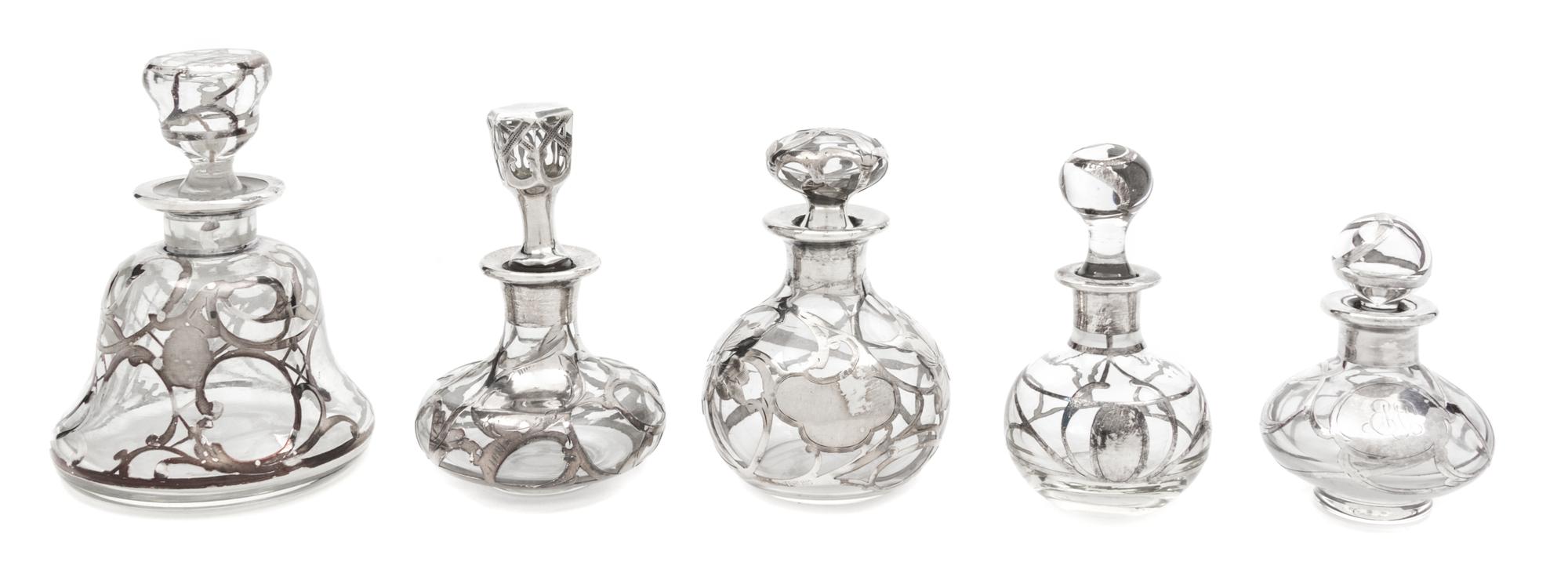 A Group of Five Silver Overlay Glass Perfume Bottles Height of tallest 4 3/4 inches.