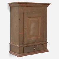 A green or brown painted pine wall cupboard late 18th century