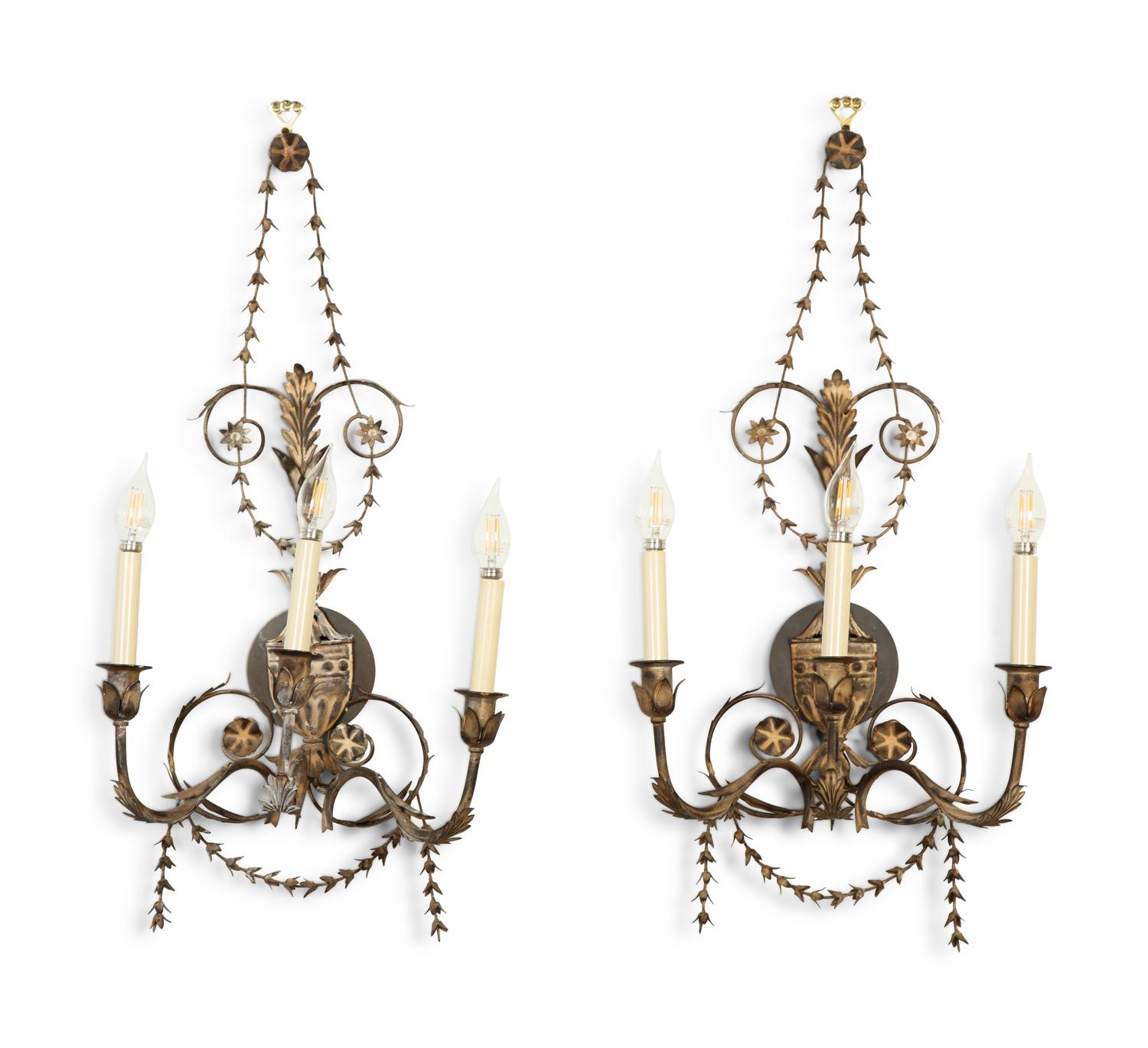 A Set of Four Neoclassical Style Pressed Metal Two-Light Sconces