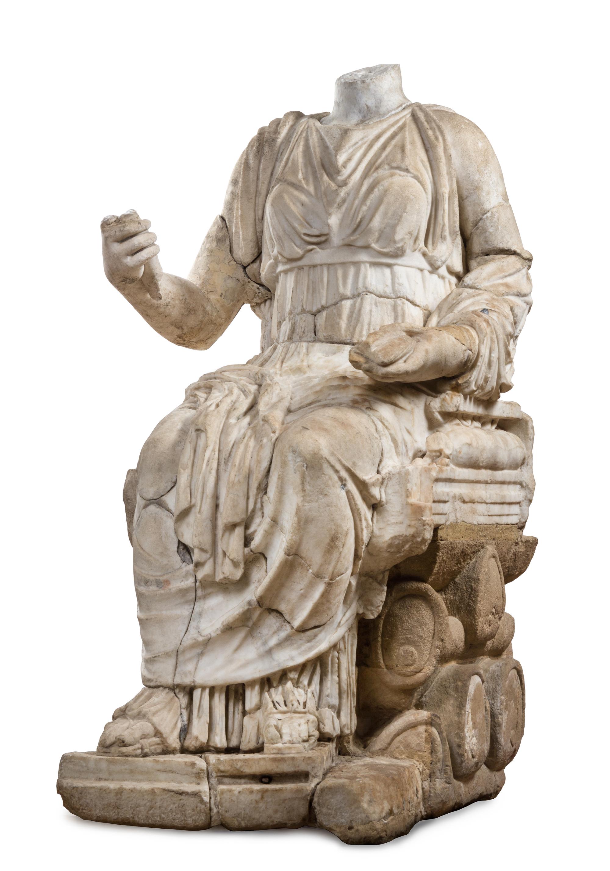 A Roman Marble Figure Height 52 x width 27 x depth 37 1/2 inches. — CIRCA 2ND CENTURY C.E. WITH LATER ELEMENTS