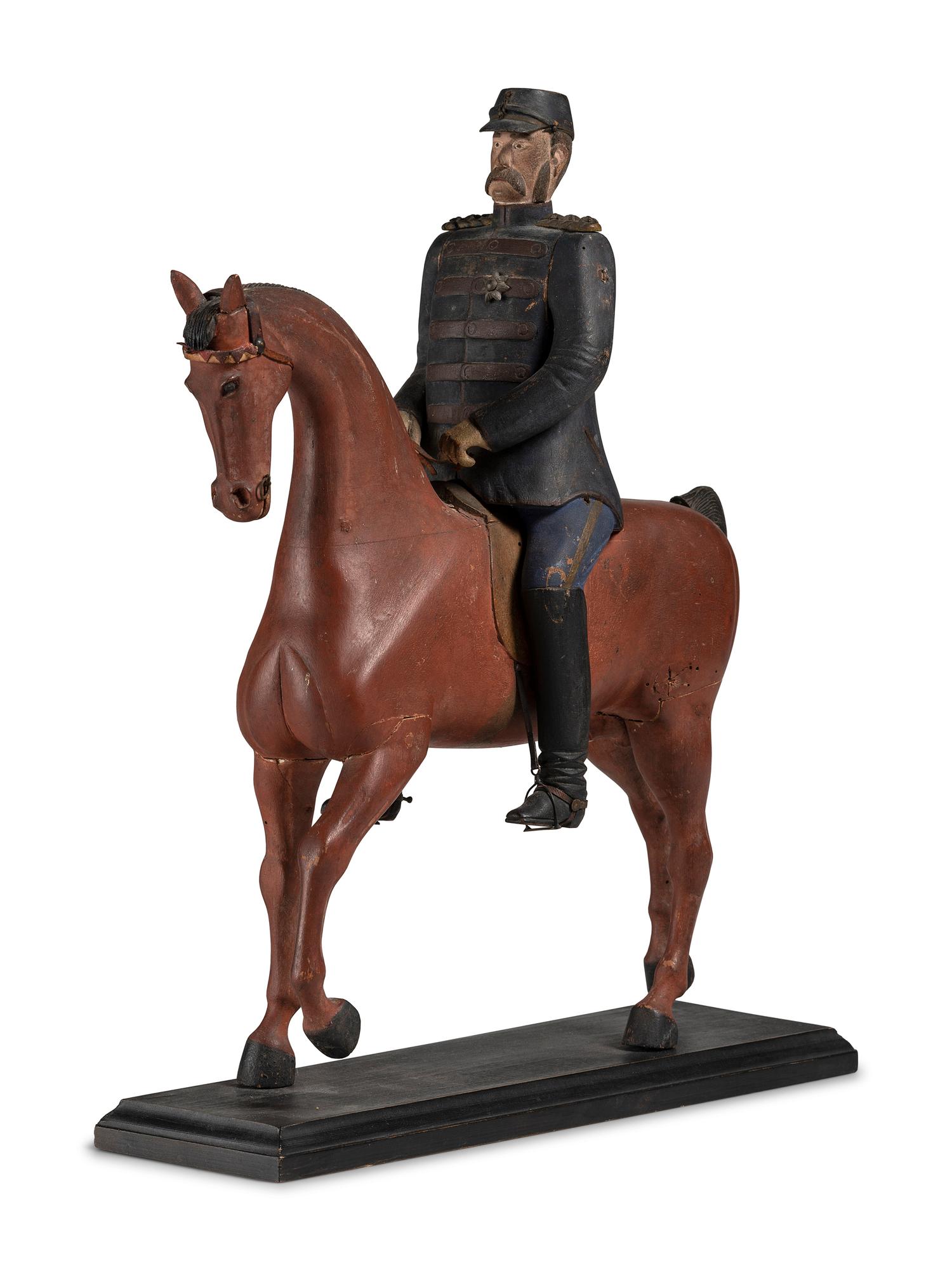 A Carved and Painted Wood Figure of a German Soldier on Horseback