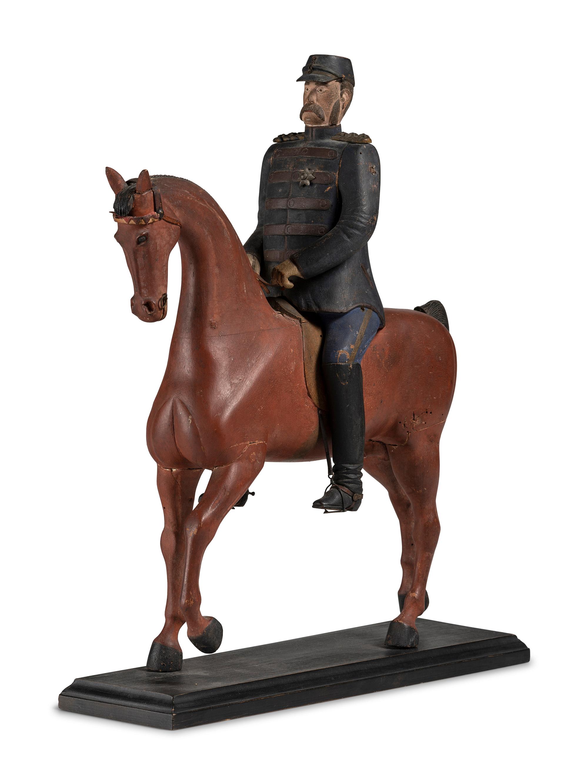 A Carved and Painted Wood Figure of a German Soldier on Horseback