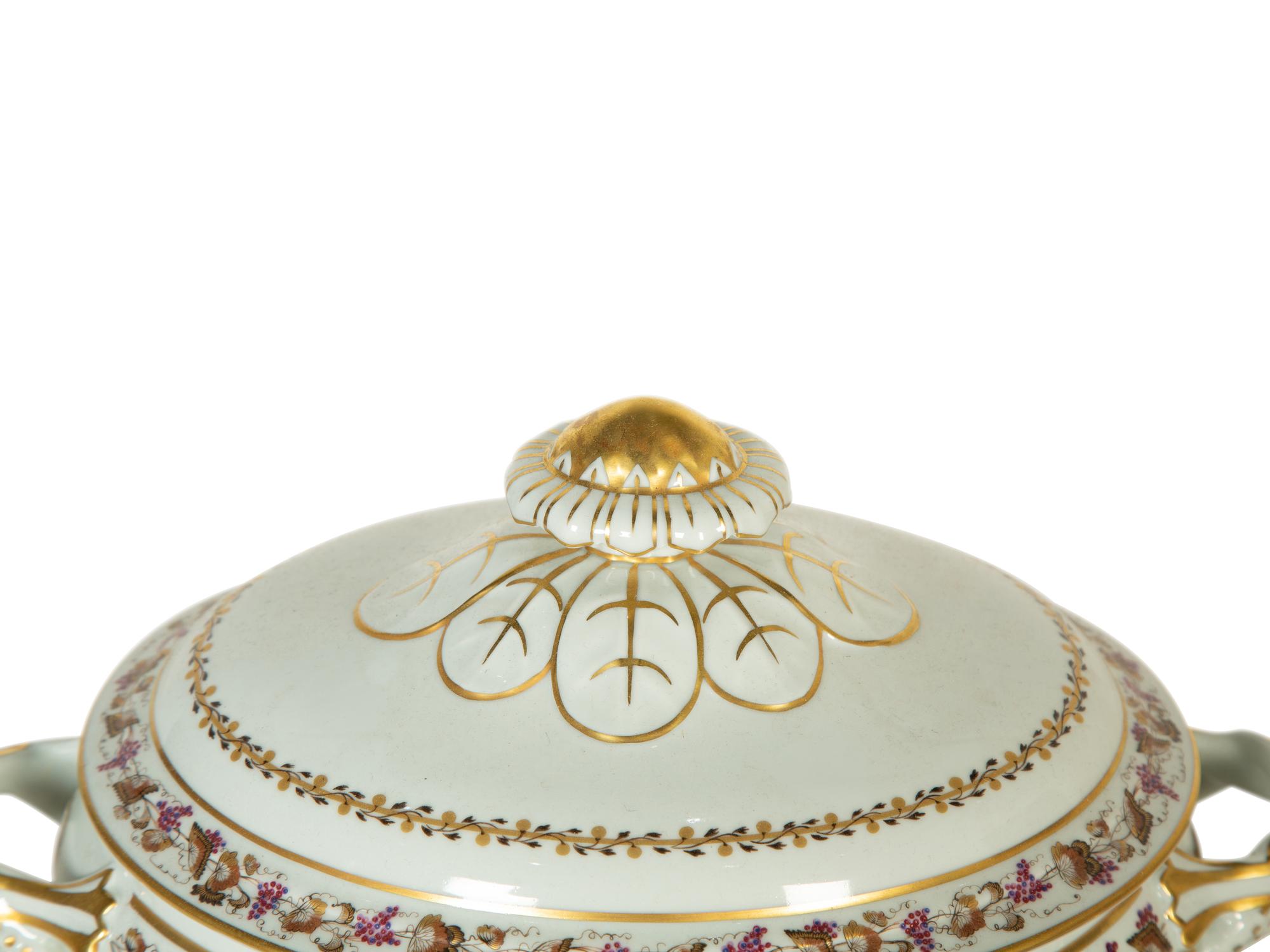 A Mottahedeh Porcelain Tureen, Underplate, and Spoon Rest