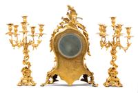 A Louis XV Style Gilt Bronze Three-Piece Clock Garniture
