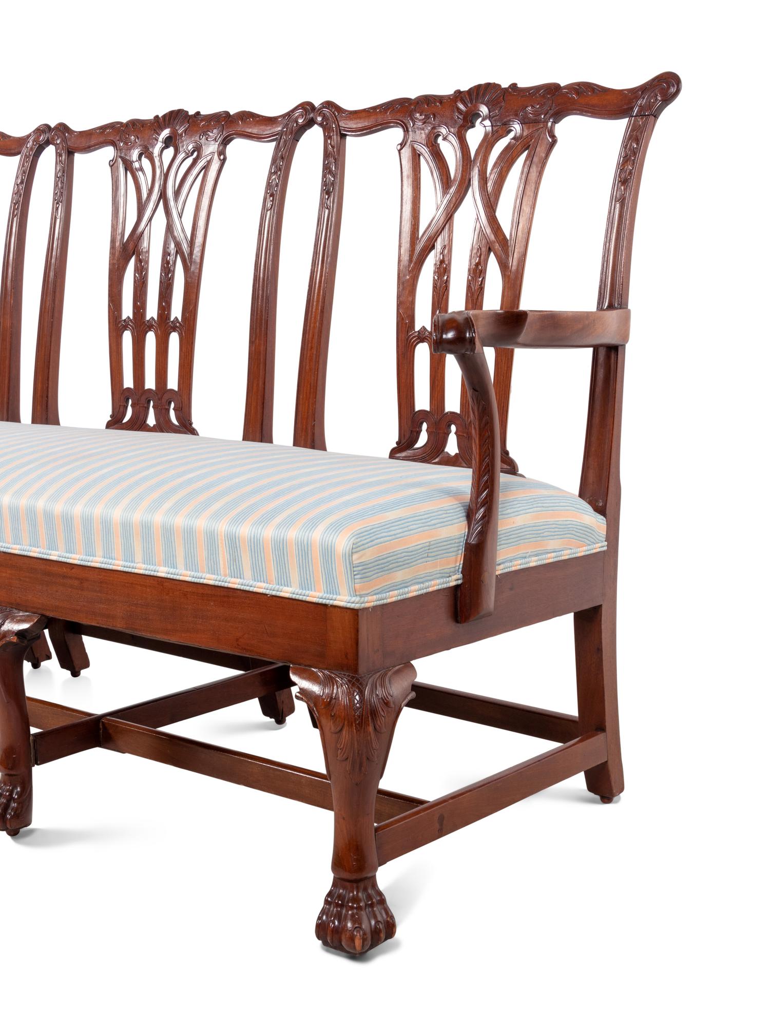 A George III Style Carved Mahogany Triple-Back Settee