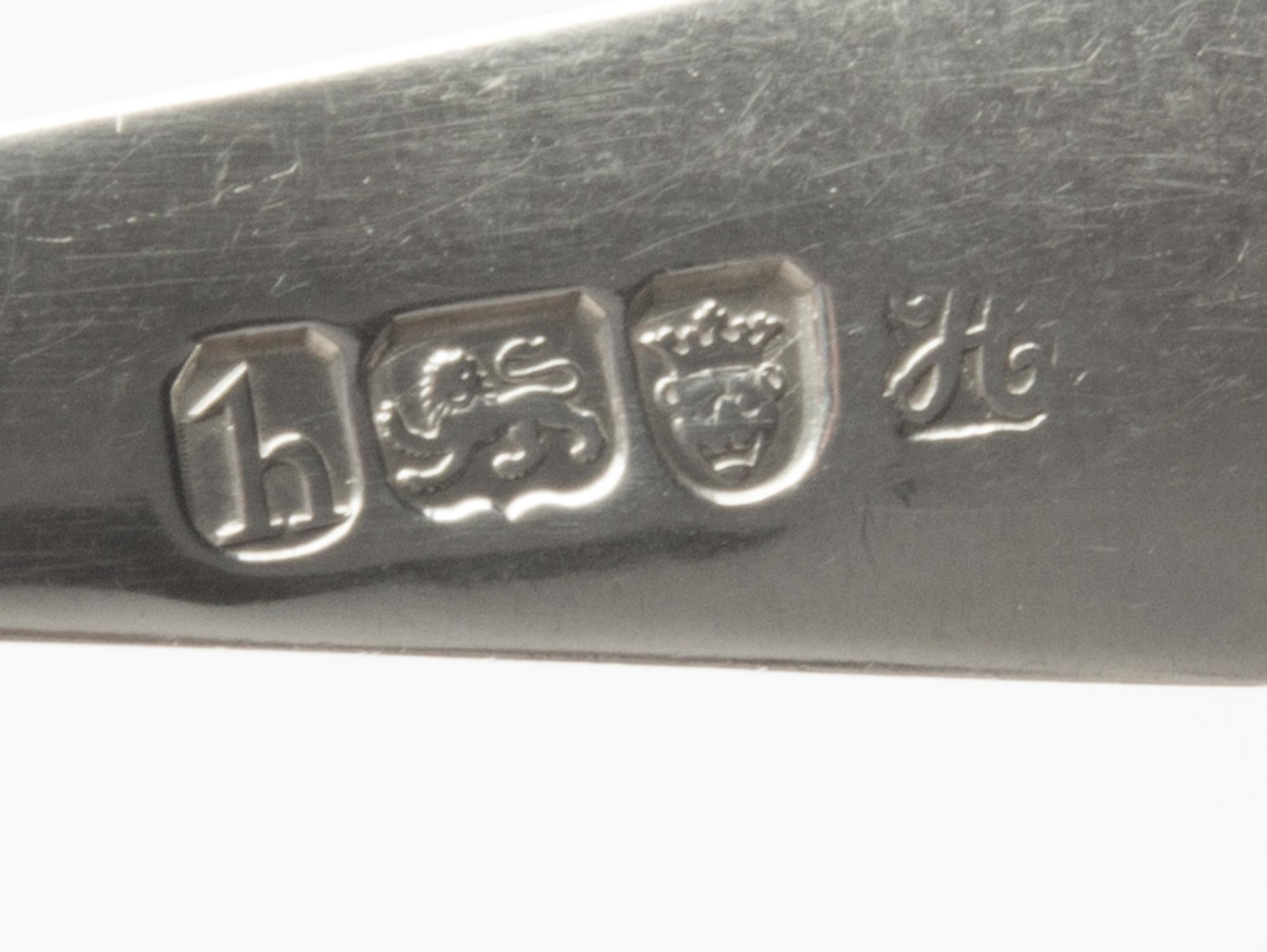 A Pair of George III Silver Table Spoons, Hester Bateman, London, 1783, the handles decorated with a griffin's head erased.