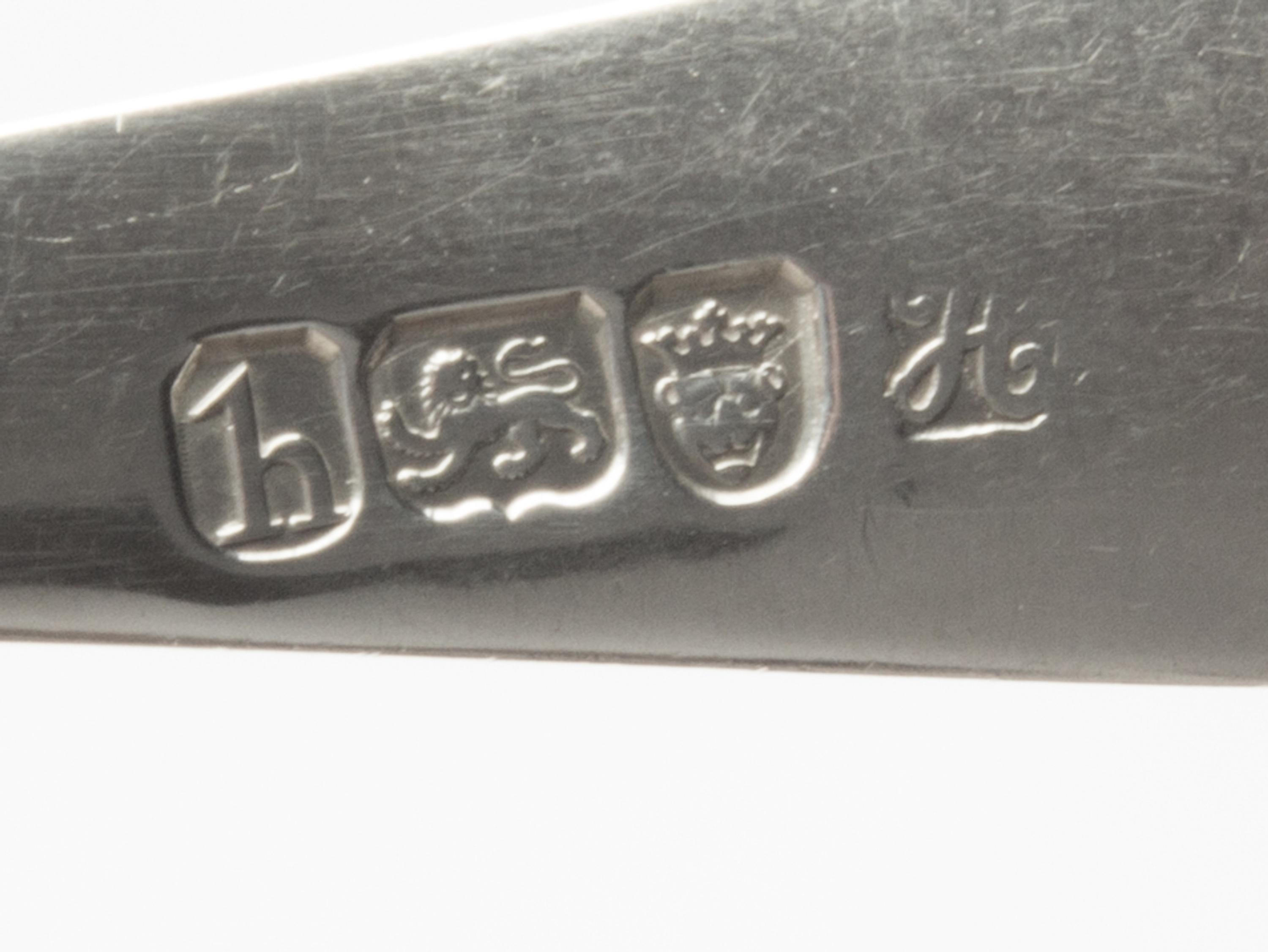 A Pair of George III Silver Table Spoons, Hester Bateman, London, 1783, the handles decorated with a griffin's head erased.