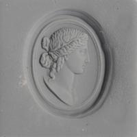 A Neoclassical Carnelian and Brass Finger Ring with a Bust of a Deity