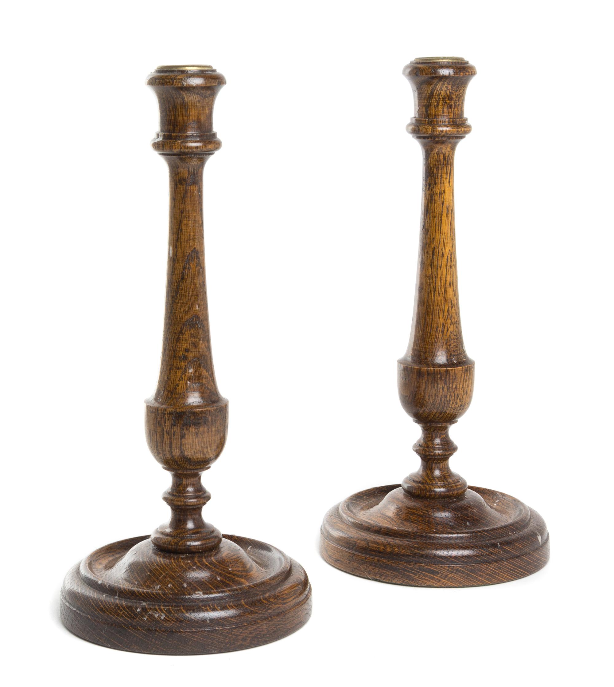 A Pair of Turned Oak Candlesticks Height 12 inches. — 19TH CENTURY