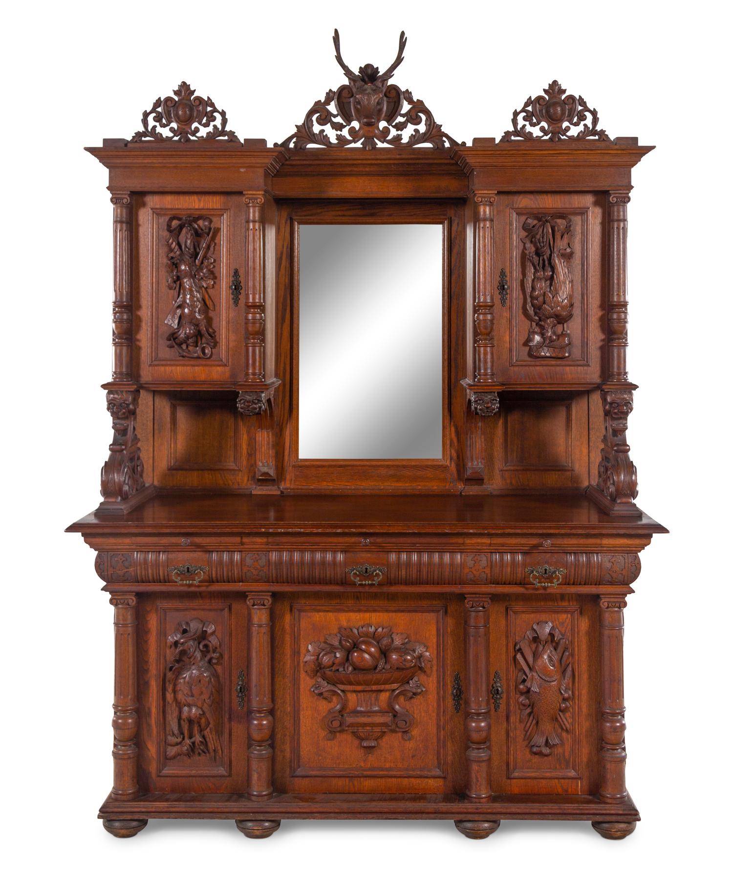 A Black Forest Style Carved Oak Serving Cabinet