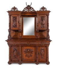 A Black Forest Style Carved Oak Serving Cabinet