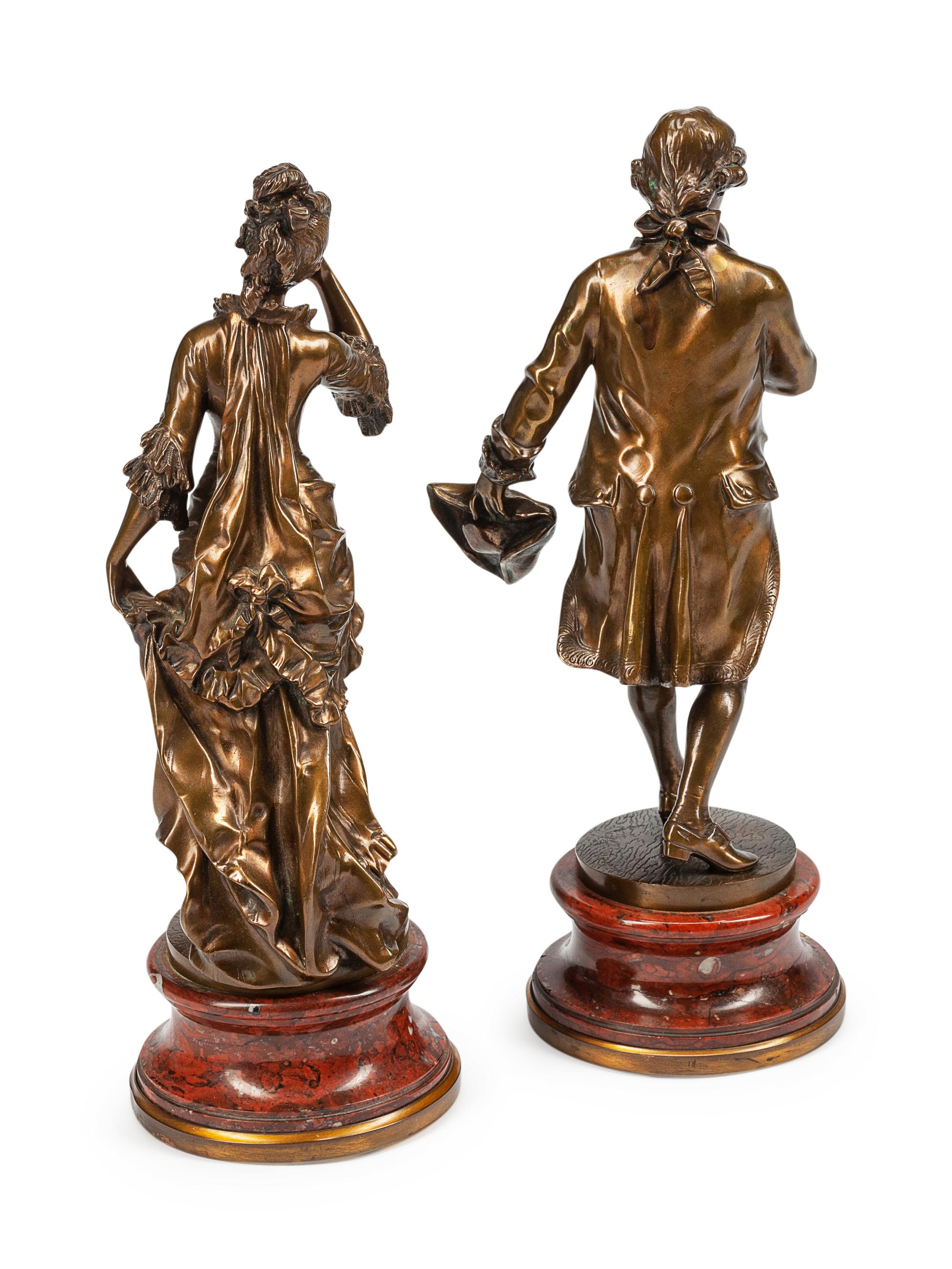 A Pair of French Patinated Bronze Figures