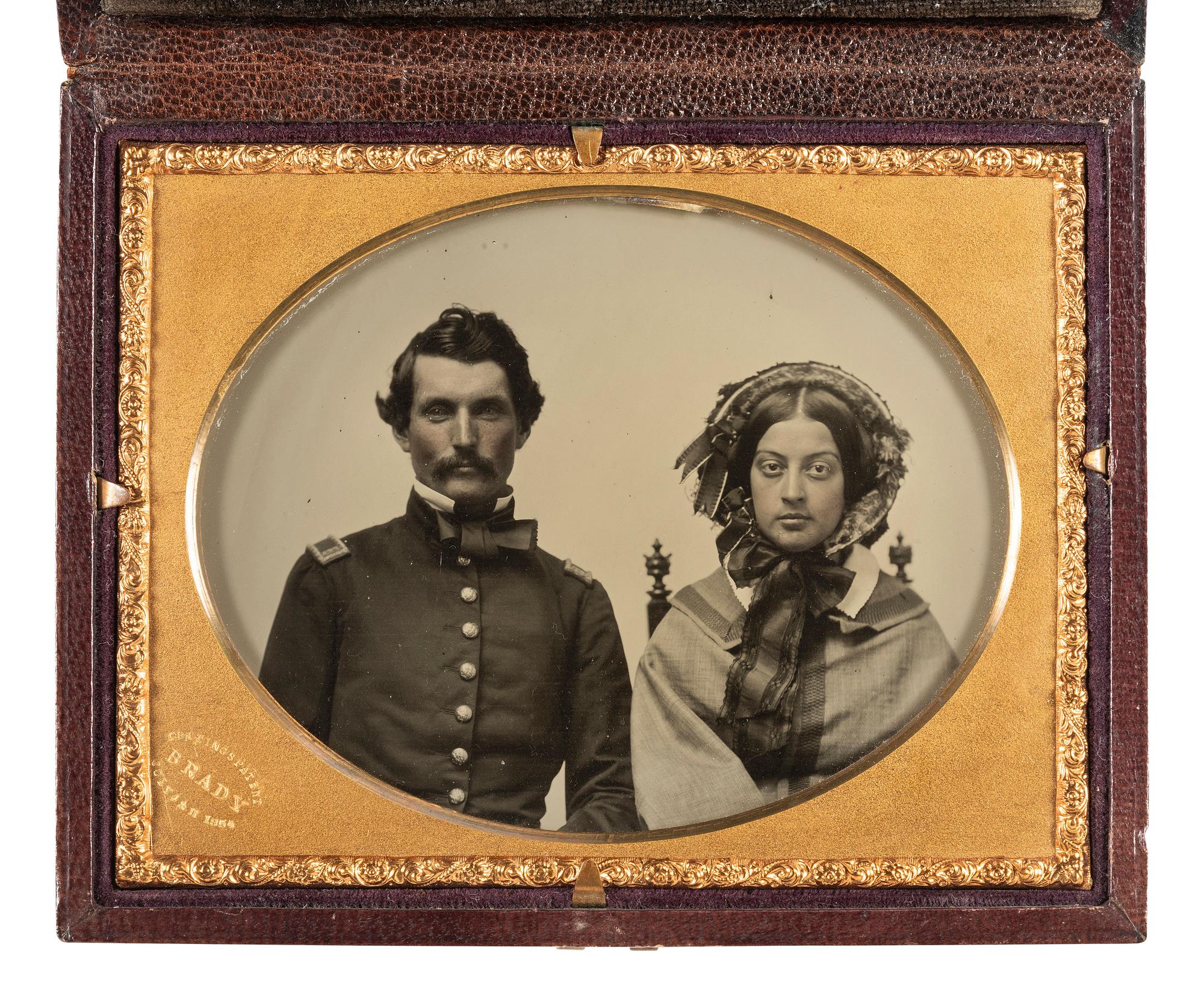 [CIVIL WAR]. BRADY, Mathew (1822-1896), photographer. Quarter plate Cutting's Patent double-sided ambrotype of a pre-war first lieutenant and his female companion.