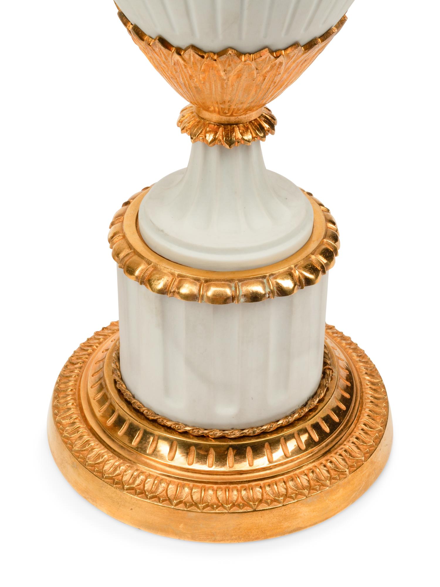 A Pair of Gilt Metal Mounted Bisque Porcelain Lamps