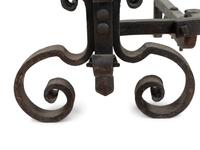 A Pair of Continental Iron Andirons with Posset Cup Holders