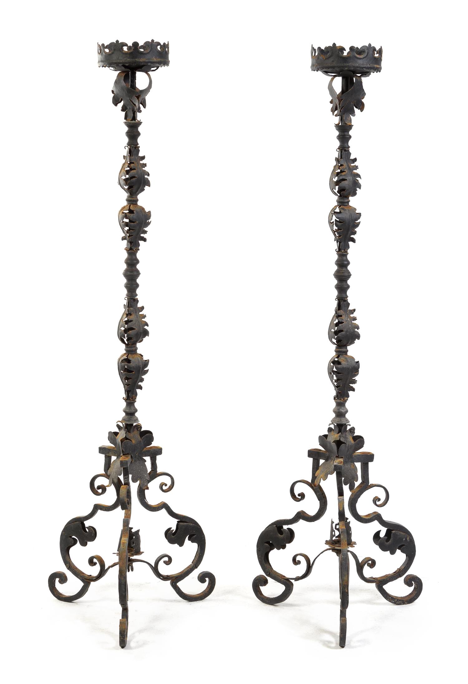 A Pair of Wrought Iron Prickets Height 67 inches.