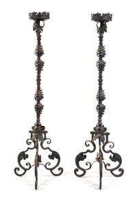 A Pair of Wrought Iron Prickets Height 67 inches.