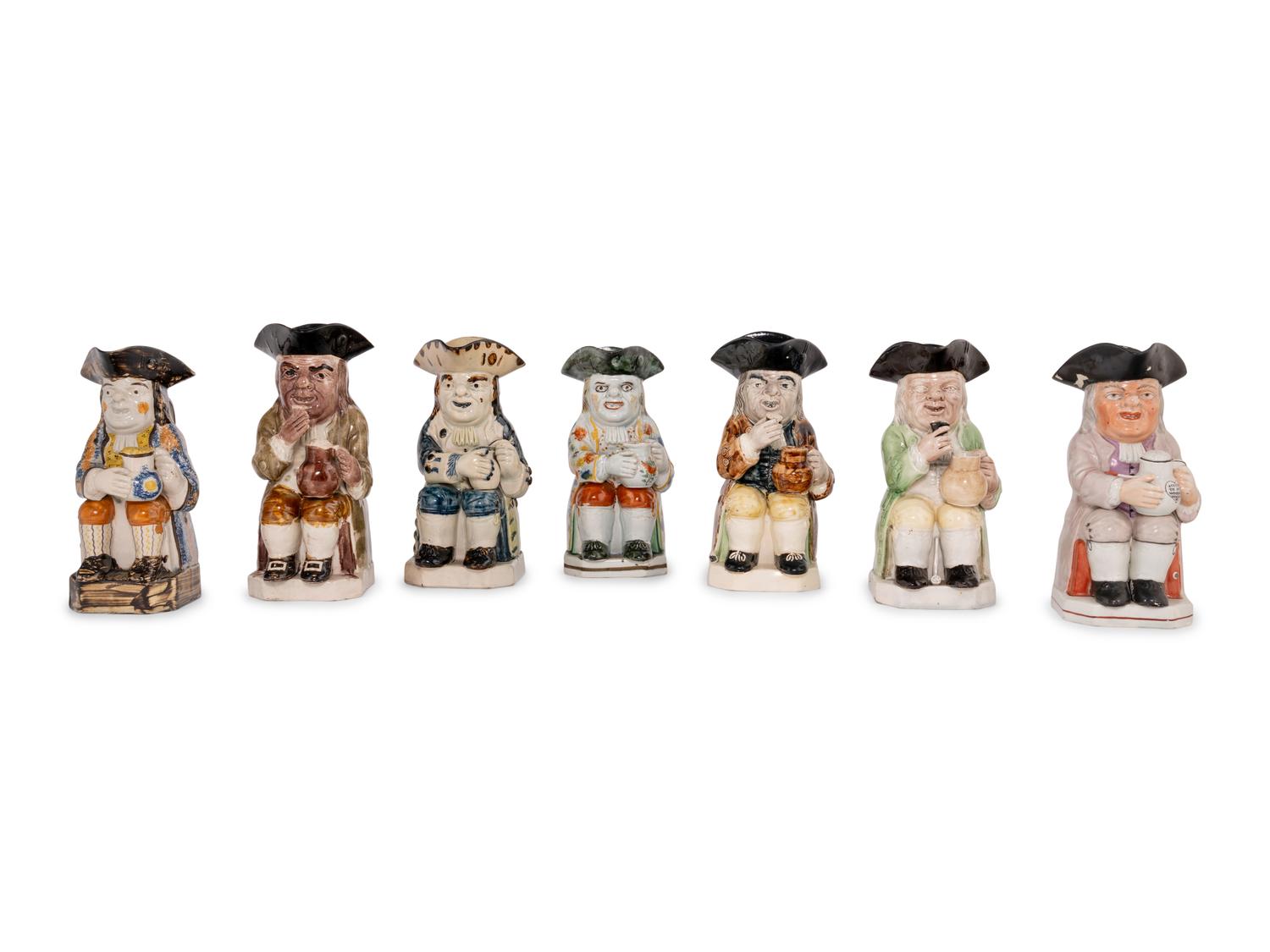 A Collection of Seven Ceramic Toby Mugs