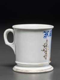 A Porcelain Shaving Mug Depicting a Steam-Powered Tractor