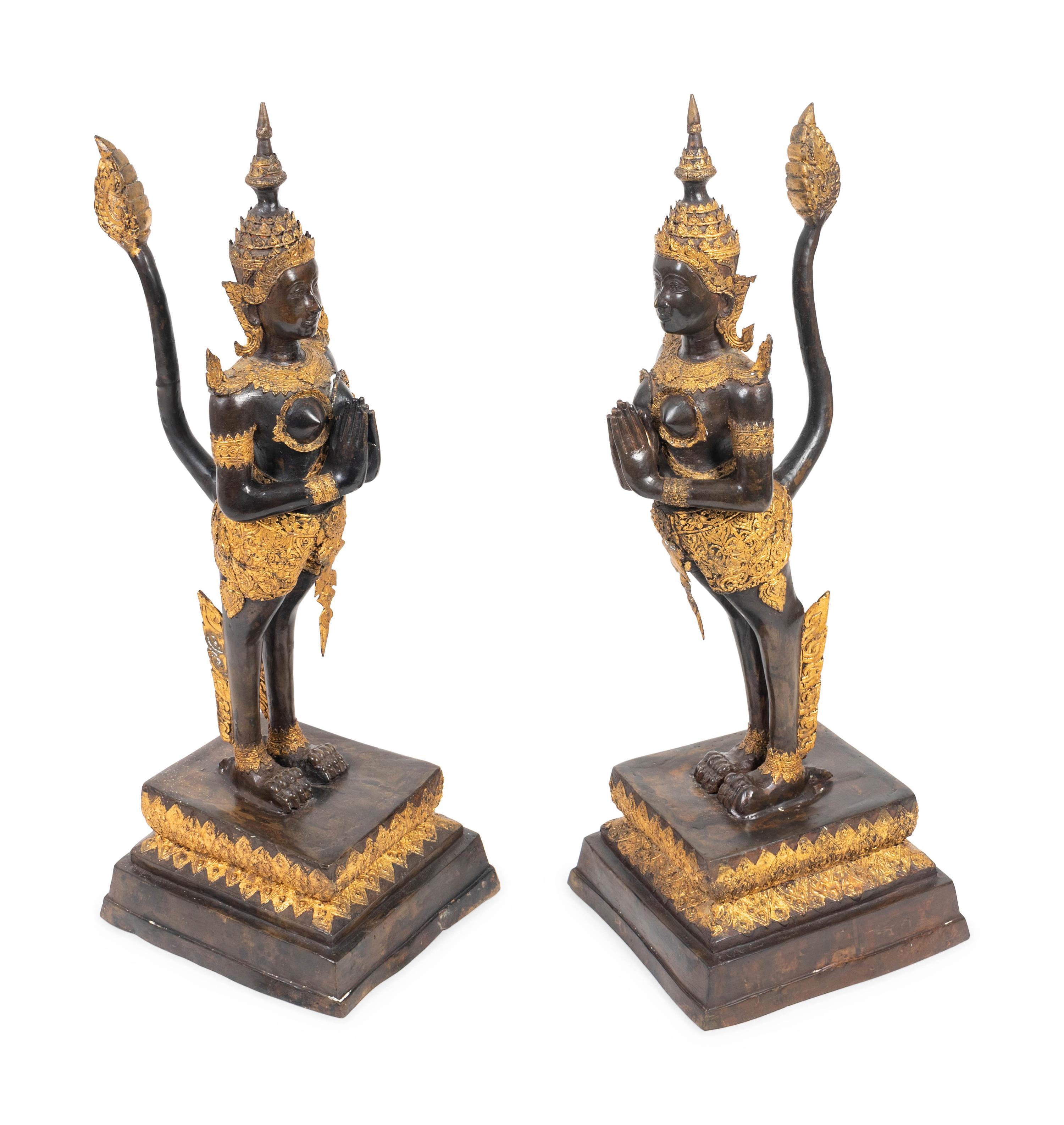 A Pair of Thai Parcel Gilt and Patinated Bronze Mythical Figures